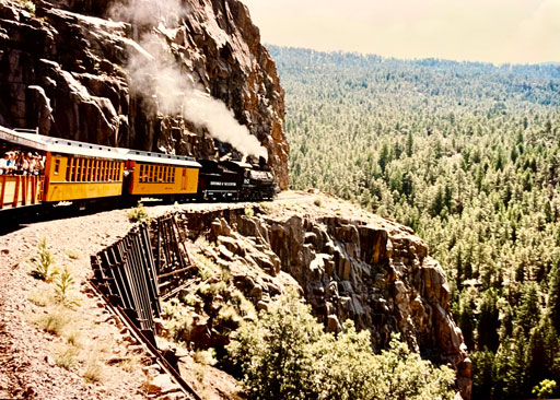 train traveling along a mountain side