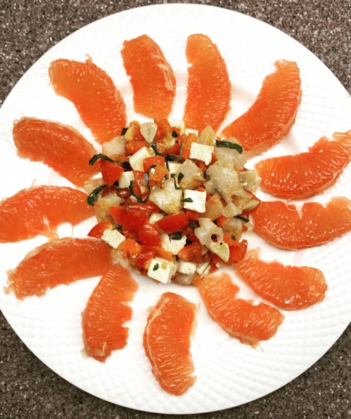 savory salad surrounded with grapefruit slices