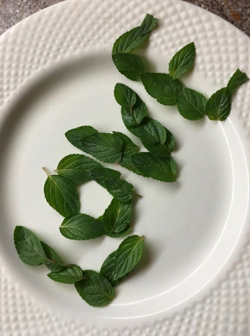 the_refreshing-herb_mint_used_to_spell_love_on_a_plate